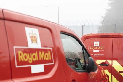 Royal Mail delivery vans parked end to end