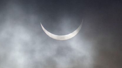 The sun in a very thin crescent shape during a solar eclipse