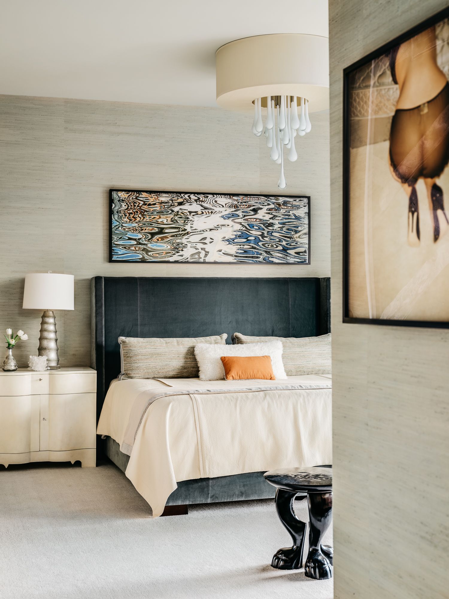 A bed with several pillows