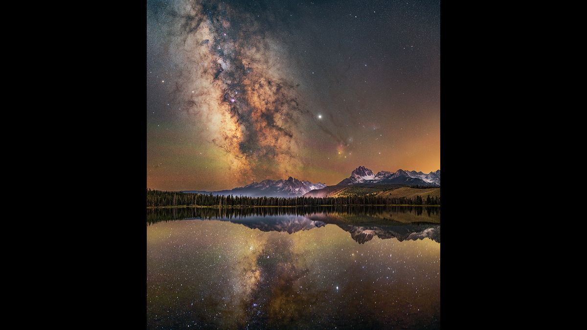 Years ago, before over-fishing, Little Redfish Lake was called as such due to the vast numbers of salmon turning the lake a red color. The red coloration is no longer seen because of salmon, but the color of sunsets and airglow during the night still turn the waters a vibrant red. It is these beautiful warm echoes of red, combined with the mirror-like reflections of the Sawtooth Mountains in the distance and the alignment of the Milky Way with the mountains that make Little Redfish Lake one of the most spectacular places the photographer has ever shot at night. The photographer recalls that &lsquo;we were fortunate enough that night to have the lakeshore to ourselves, just three of us, and a rather excited dog who tried his best not to run into our tripods! We spent the sunset here, waiting for the stars to come out and the Milky Way core to rise, marveling at the red color of the water.&rsquo;