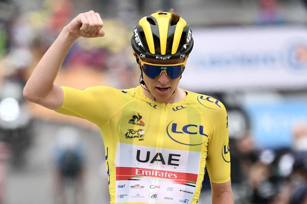 Team UAE Emirates Tadej Pogacar of Slovenia wearing the overall leaders yellow jersey celebrates as he crosses the finish line during the 18th stage of the 108th edition of the Tour de France cycling race 129 km between Pau and Luz Ardiden on July 15 2021 Photo by Philippe LOPEZ AFP Photo by PHILIPPE LOPEZAFP via Getty Images