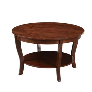 A dark brown circular coffee table