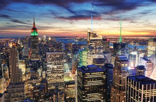 New York City skyline with urban skyscrapers at sunset.