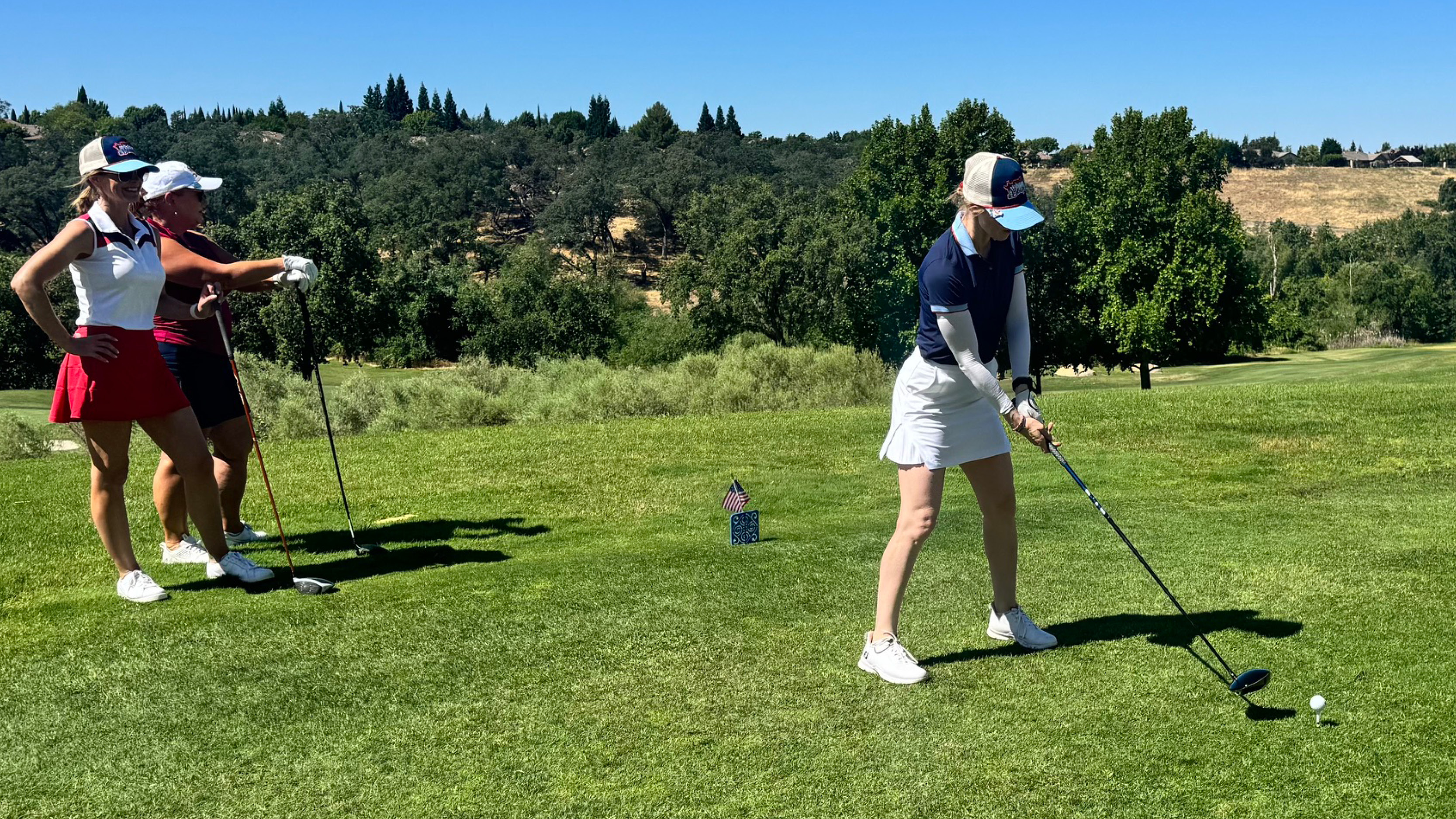 Female golfers on the tee