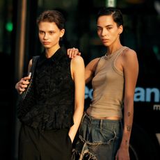 two attendees at paris fall 2025 fashion week 