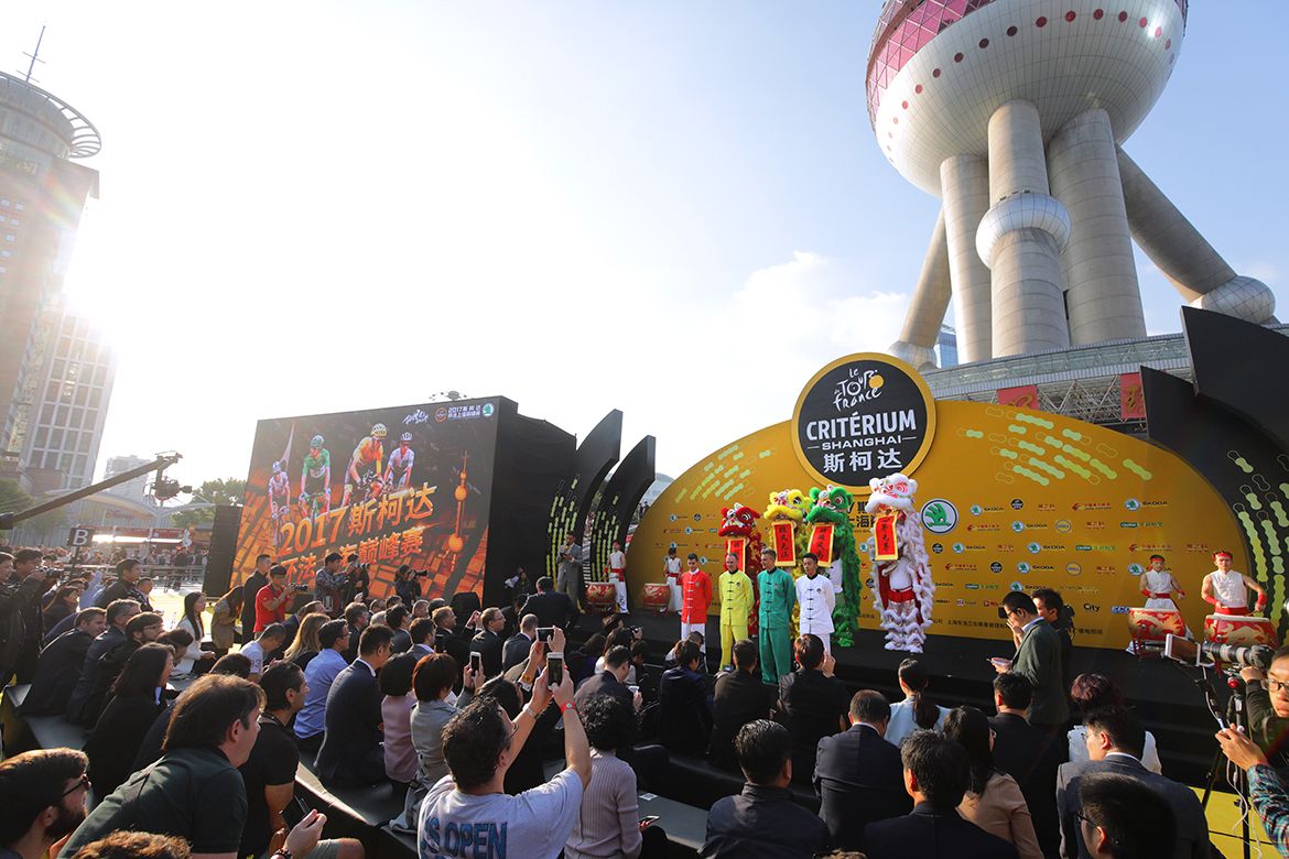 Lion dancing in front of the Shanghai Pearl Tower