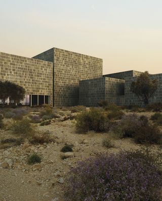 A render of Asif Khan’s Museum of Manuscipts, currently under construction in Sharjah. It features a latticed stone façade – inspired by local Arish (palm-leaf) architecture and coral stone walls – which provided the starting point for his Re-Made collaboration with BioMason