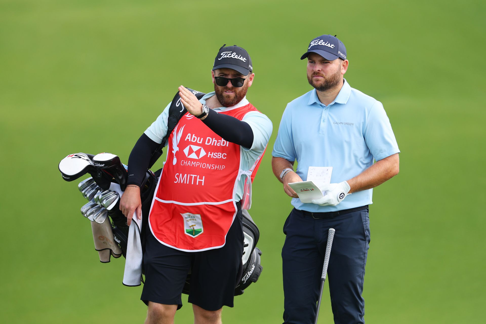 Jordan Smith (right) and his caddie Sam Matton (left) playing at the Abu Dhabi HSBC championship