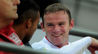 LONDON, ENGLAND - OCTOBER 12: Wayne Rooney of England smiles as he talks to Ashley Cole after being substituted during the FIFA 2014 World Cup Group H qualifying match between England and San Marino at Wembley Stadium on October 12, 2012 in London, England. (Photo by Michael Regan - The FA/The FA via Getty Images)