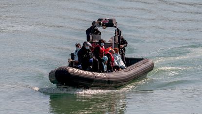  Border Force escorting migrants into Dover 