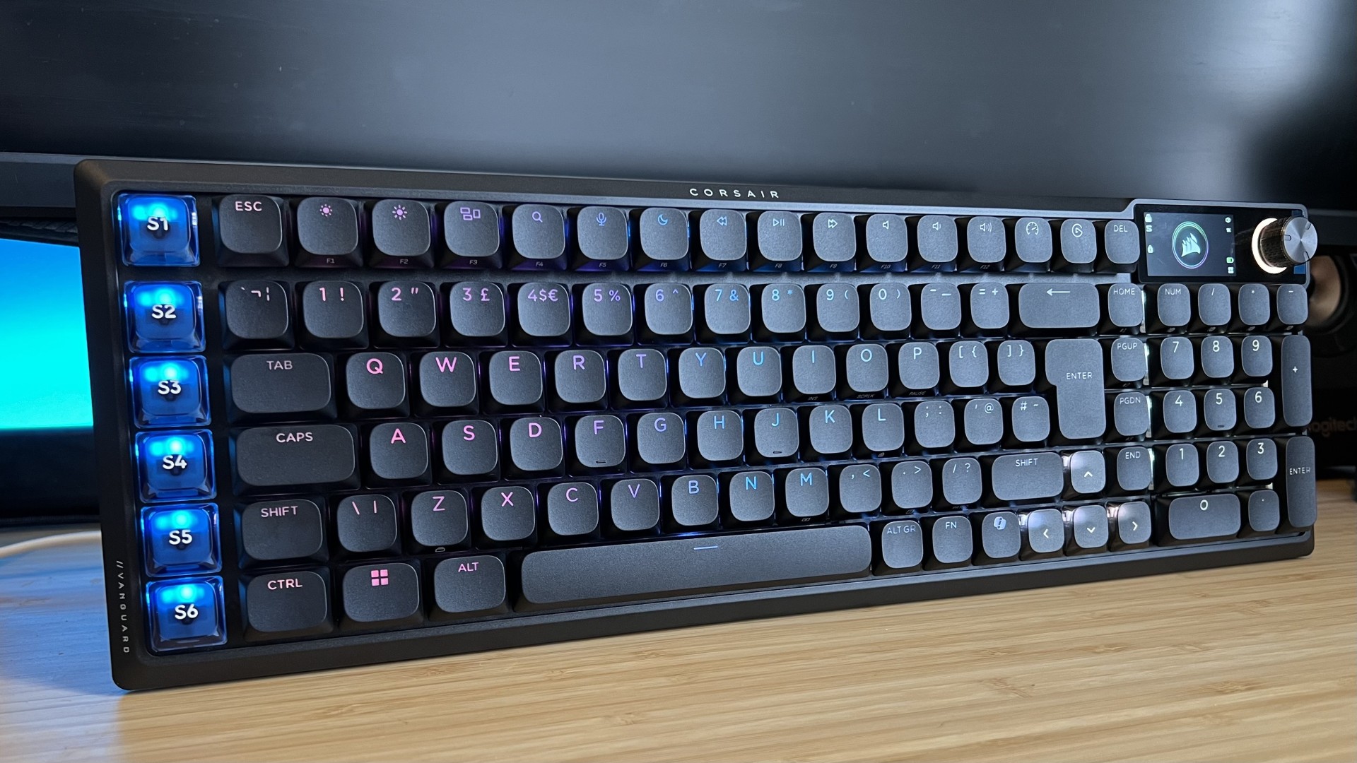 Corsair Vanguard Air 99 Wireless gaming keyboard standing on a wooden desk