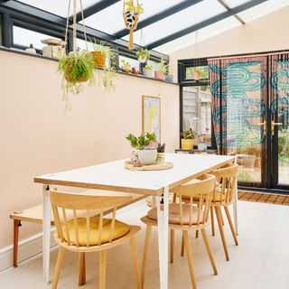 contemporary open plan kitchen diner space with plywood kitchen cabinetry