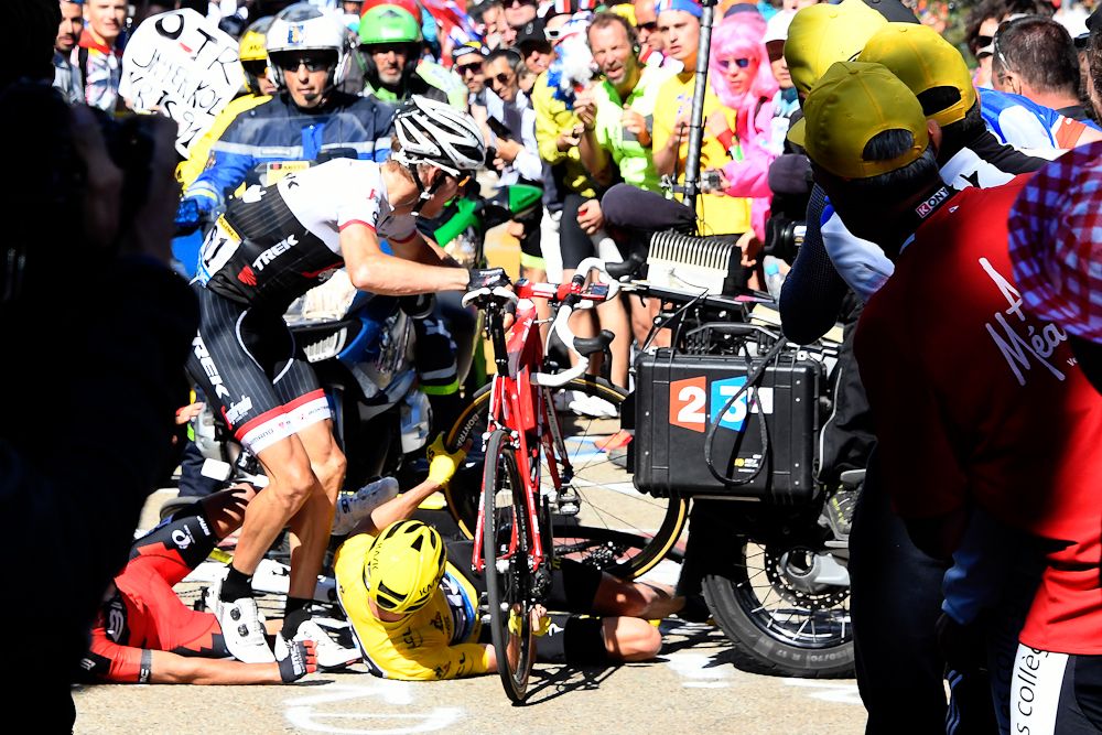 Bauke Mollema attempts to get going again as Chris Froome lies on the ground during stage 12 of the Tour de France