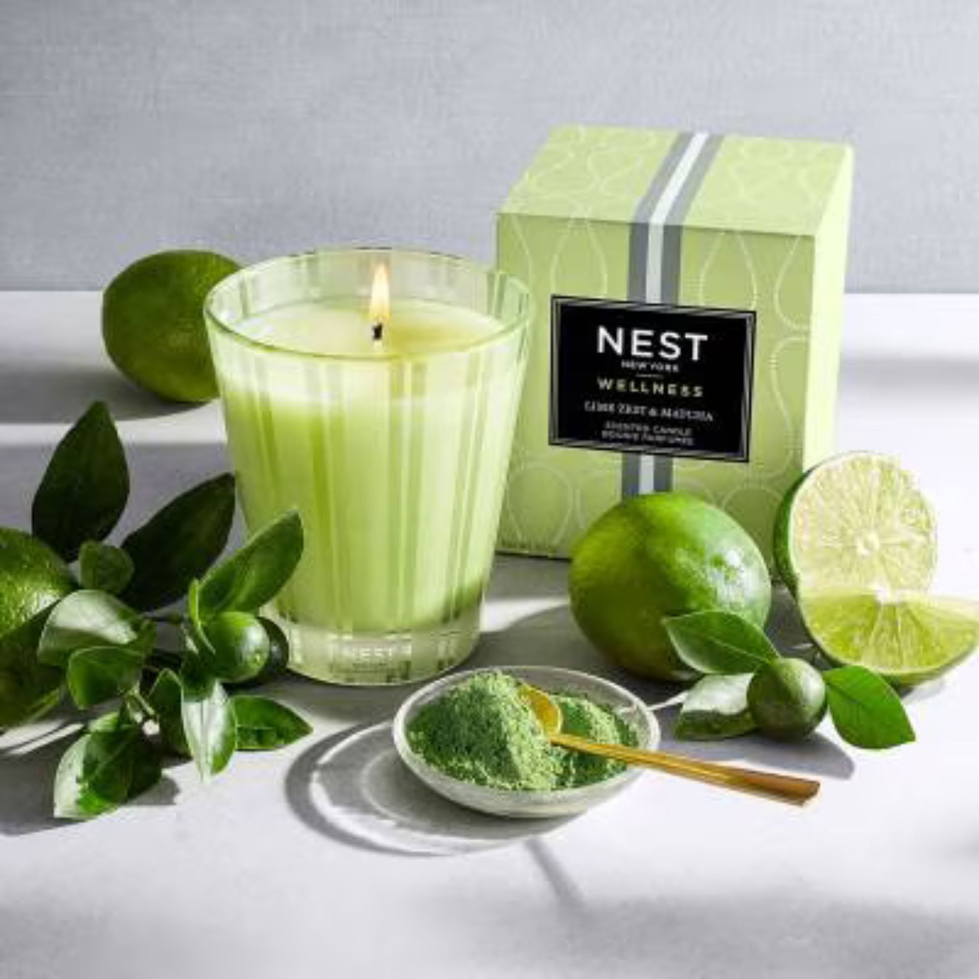 Lime Zest and Matcha Candle against a gray background.