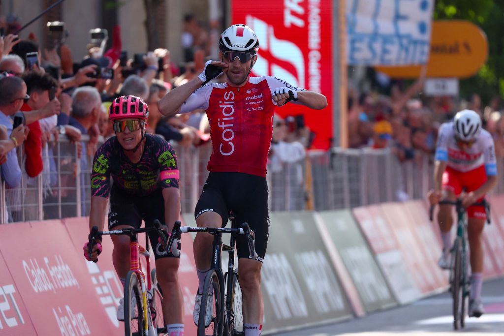 Team Cofidis' French rider Benjamin Thomas celebrates as he crosses the finish line to win the 5th stage of the 107th Giro d'Italia cycling race, 178 km between Genova and Lucca, on May 8, 2024 in Lucca. (Photo by Luca Bettini / AFP)
