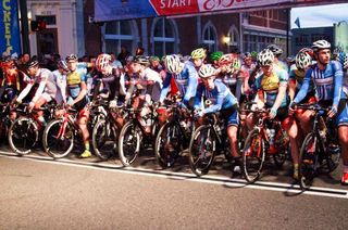 The men's field await the start of the 60-lap Sunny King Criterium