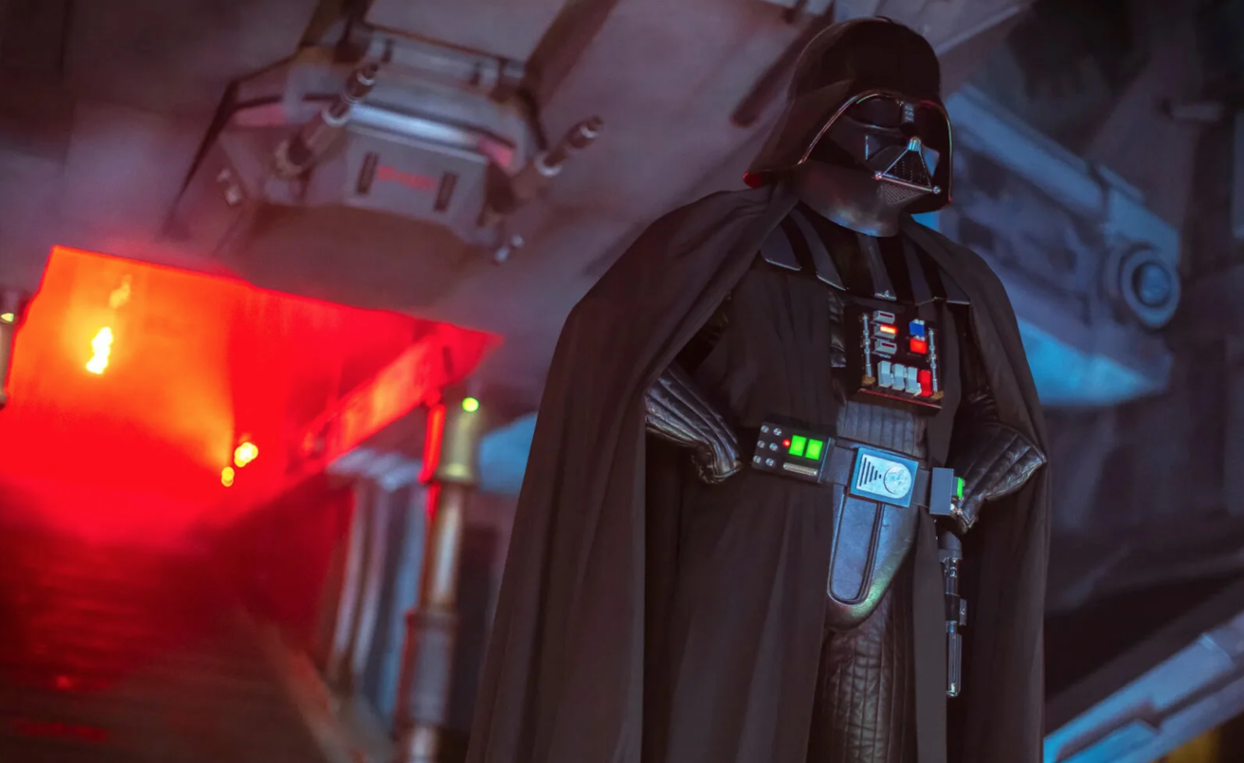 a black-masked sci-fi villain in a cape