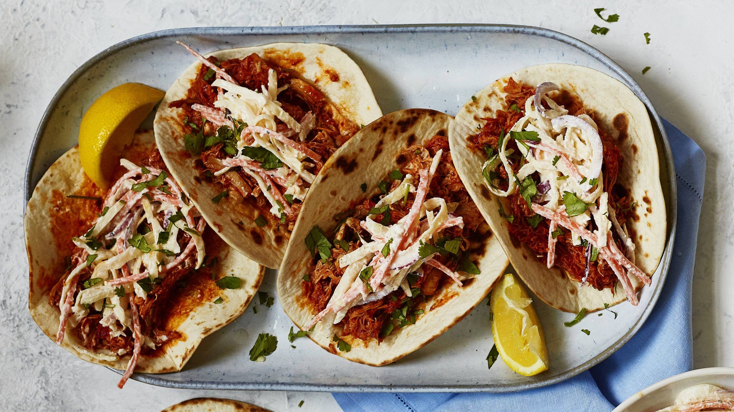 Harissa pulled chicken with feta yogurt slaw recipe