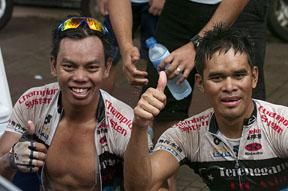 A Malaysian double: Stage winner Anuar Manan (left) and Terengganu Cycling teammate and runner-up Harif Saleh celebrate their feat in Chengmai.