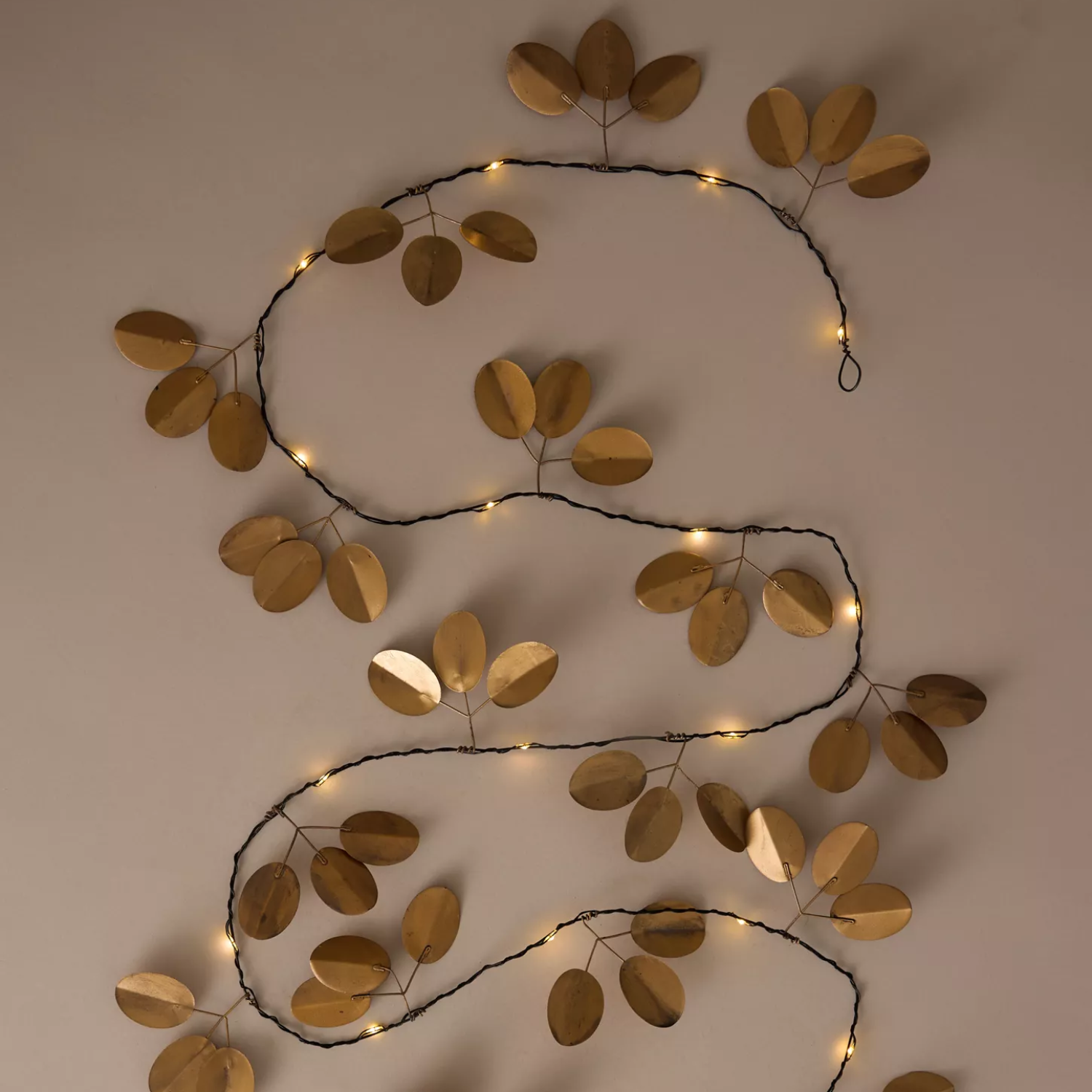 A gold eucalyptus light garland