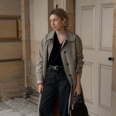 @brittanybathgate wearing a trench coat and jeans