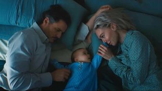 Pedro Pascal's Reed Richards and Vanessa Kirby's Sue Storm cuddling Baby Franklin in The Fantastic Four: First Steps