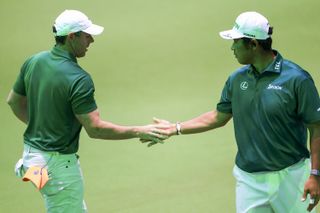 Rory McIlroy and Hideki Matsuyama high five