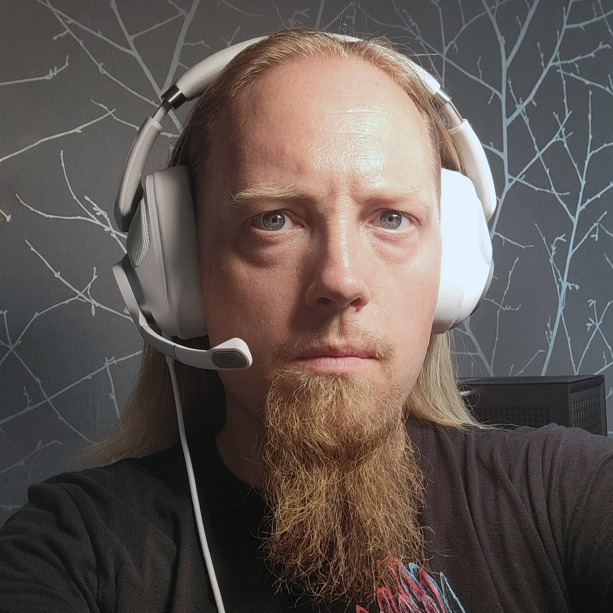 Matt Safford wearing a white Epos headset