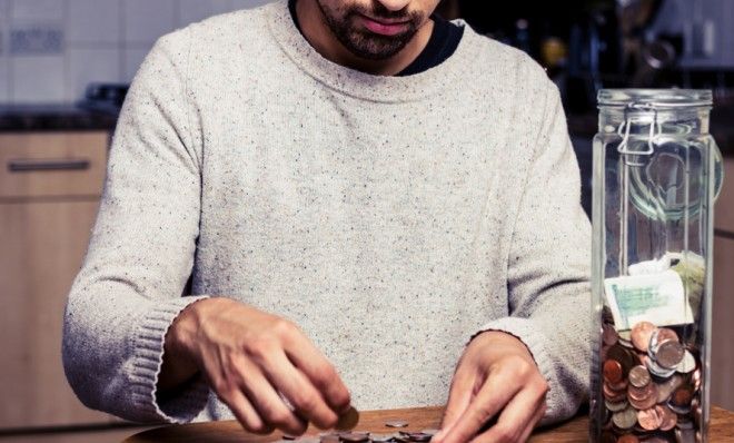 Man counting pennies