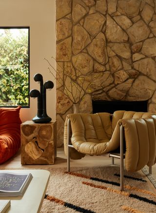 A living room with 30s style fireplace and mid-century touches