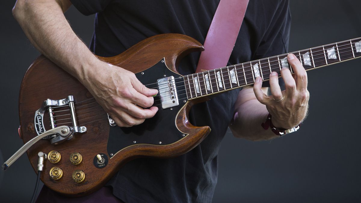 A close up of guitarist Bill Frisell&#039;s hands as he performs on stage with The Bill Frisell Trio during a soundcheck, Rome, Italy, 10 July 2019. He is playing a Gibson SG guitar fitted with a Bigsby vibrato unit.