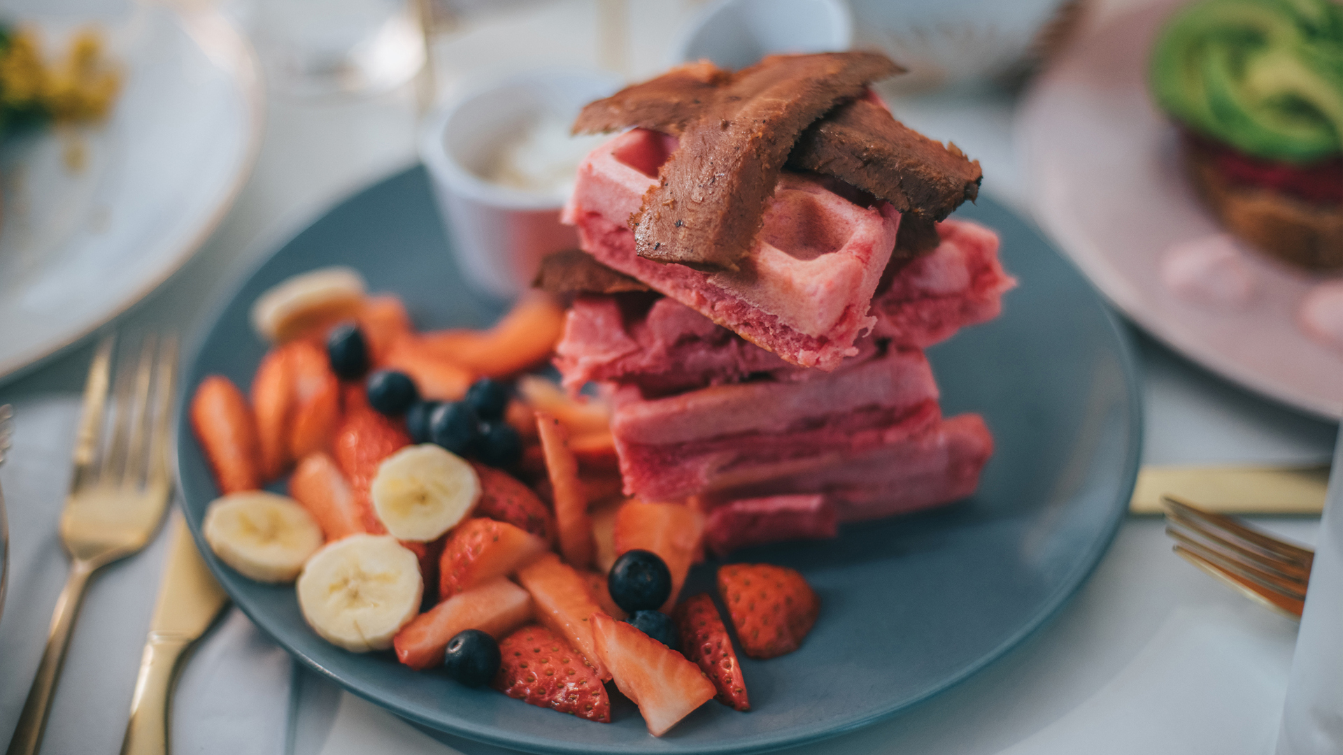 vegan bacon with waffles and fresh berries