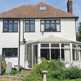 property with a conservatory before renovation