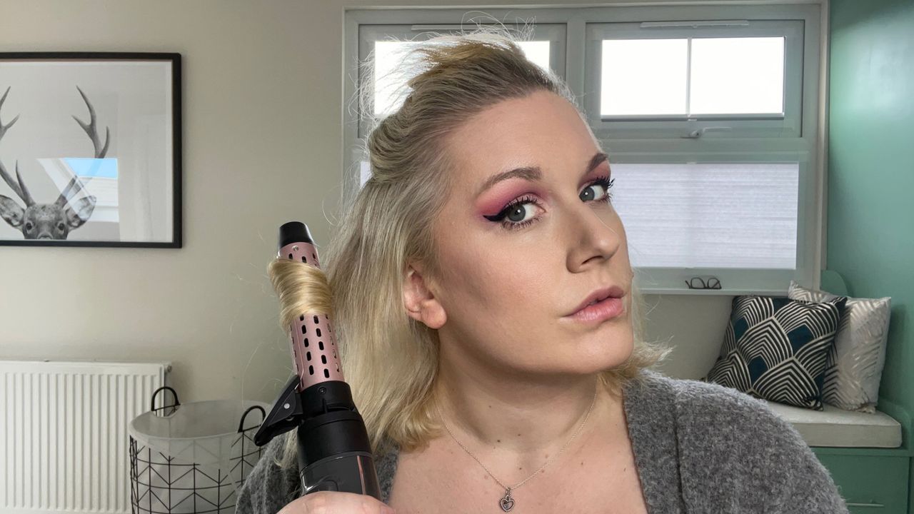 The Remington Curl and Straight Confidence Airstyler being used to curl hair