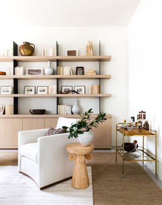 Neutral living room with wooden shelving