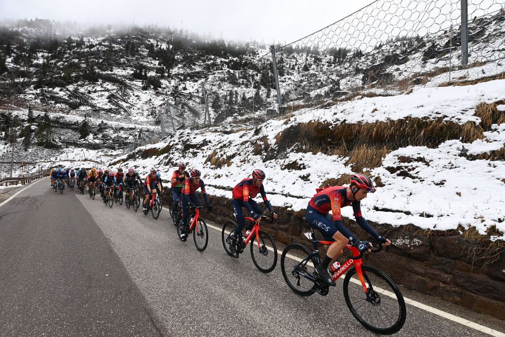BRUNICO ITALY APRIL 21 LR Tao Geoghegan Hart of United Kingdom Green Leader Jersey Geraint Thomas of United Kingdom Laurens De Plus of Belgium and Thymen Arensman of The Netherlands and Team INEOS Grenadiers lead the peloton climbing to the snowy and mountainous pass of the Passo Lavaz 1808m during the 46th Tour of the Alps 2023 Stage 5 a 1445km stage from Cavalese to Brunico on April 21 2023 in Brunico Italy Photo by Tim de WaeleGetty Images