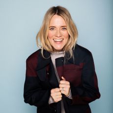 Edith Bowman smiling and wearing a black jacket