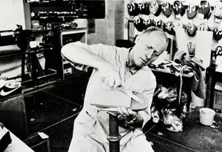 Publicity shot of Bill Bowerman in his workshop at the Eugene Lab, 1980