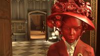A woman in a red mask and hat