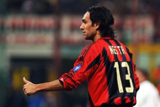 Alessandro Nesta gives a thumbs-up gesture in a game for AC Milan against Manchester United in March 2005.