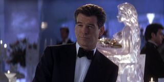 Pierce Brosnan in a tuxedo with a sly smile in Die Another Day.