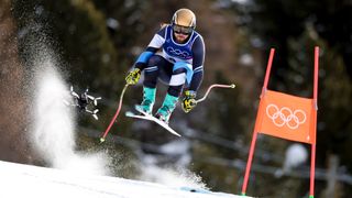 BORMIO, ITALY - FEBRUARY 07: Barnabas Szollos of Team Israel skis as a drone follows him down the course during the Men's Downhill on day one of the Milano Cortina 2026 Winter Olympics at Stelvio Alpine Skiing Centre on February 07, 2026 in Bormio, Italy. (Photo by Dustin Satloff/Getty Images)