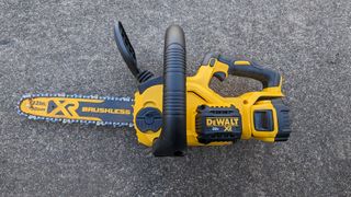 DeWALT deals | Top view of the DeWalt 20V MAX XR DCCS620P1 12 in. Battery Chainsaw as it lays on its side