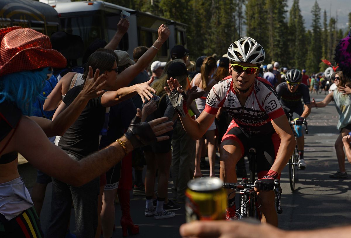 Carson Miller high-fives the crowd and is offered a beer