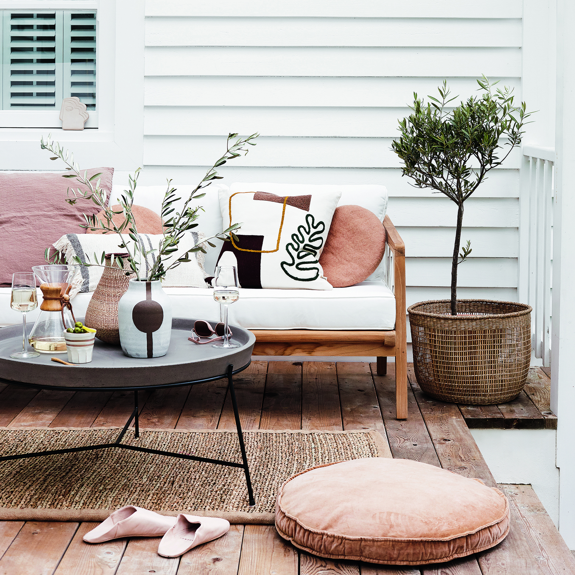 decking area with wooden flooring and white wall