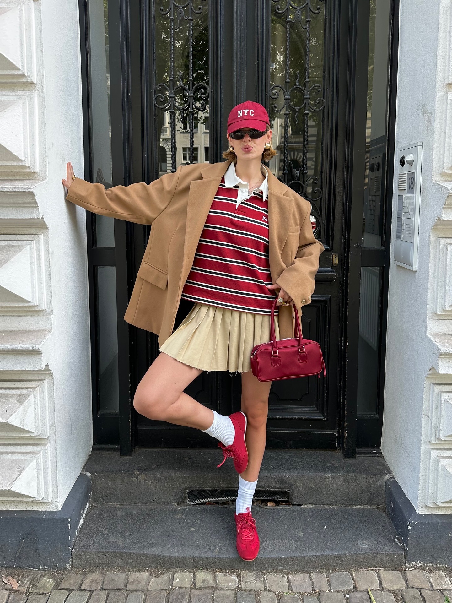 Fashion person Linda Sza wears colourful trainer outfits.