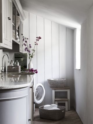 narrow utility room ideas with pale walls and curved edge countertop