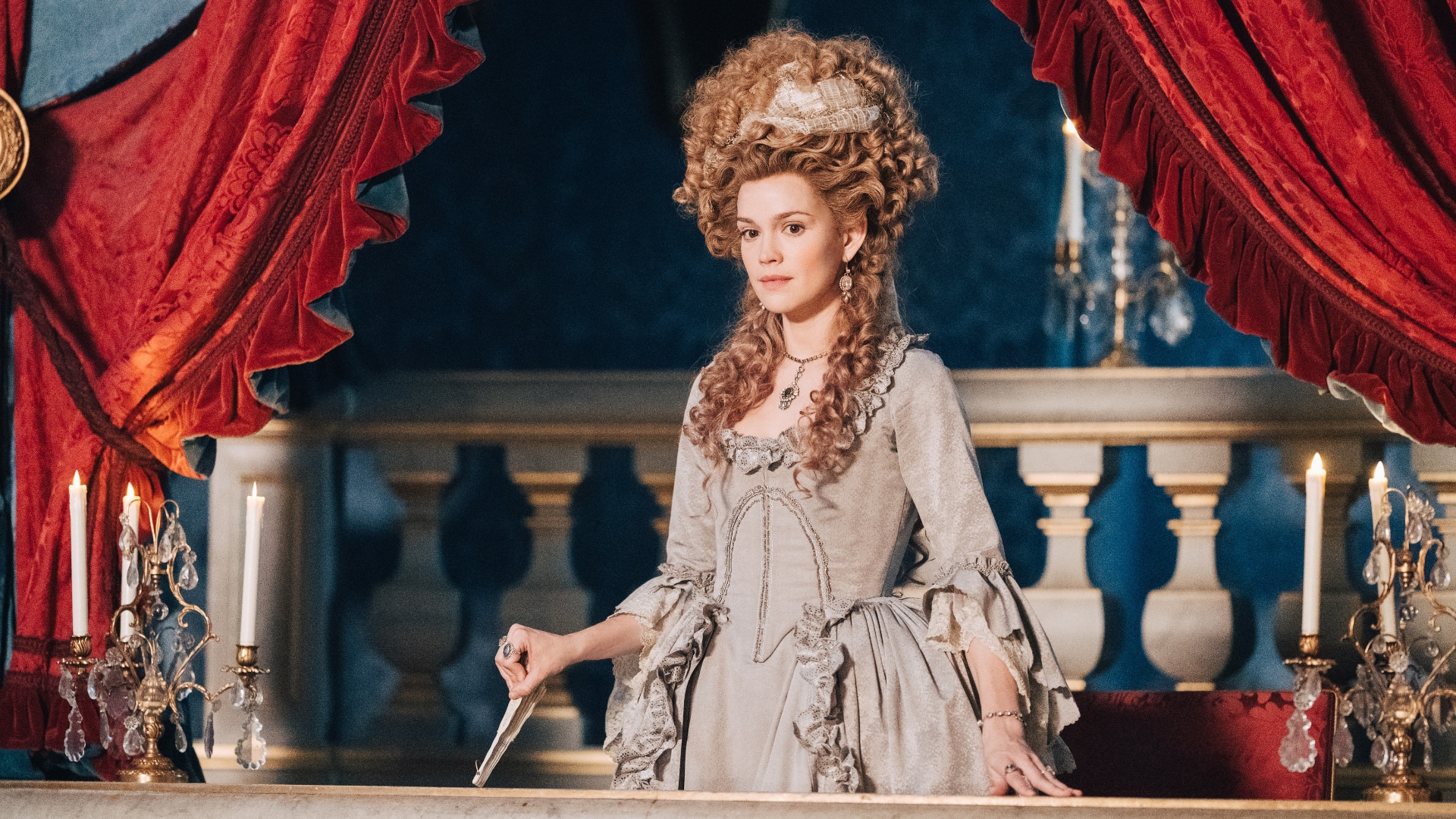 Marie stands at the theatre balcony in Marie Antoinette