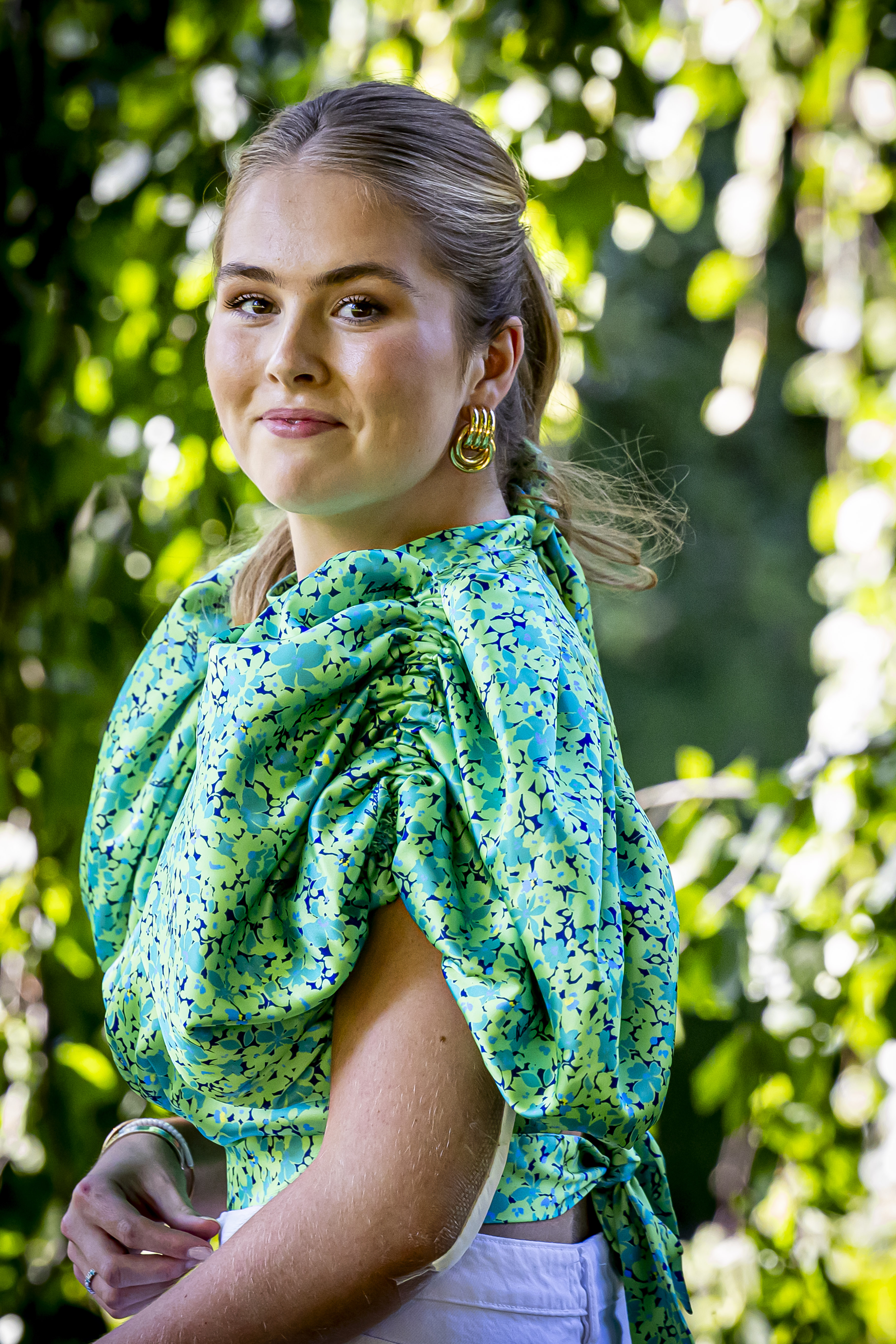 Princess Catharina-Amalia wearing a green top and smiling