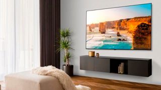 LG B3 OLED TV hanging on a wall in a living room